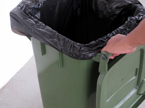 Workers sorting construction debris for recycling
